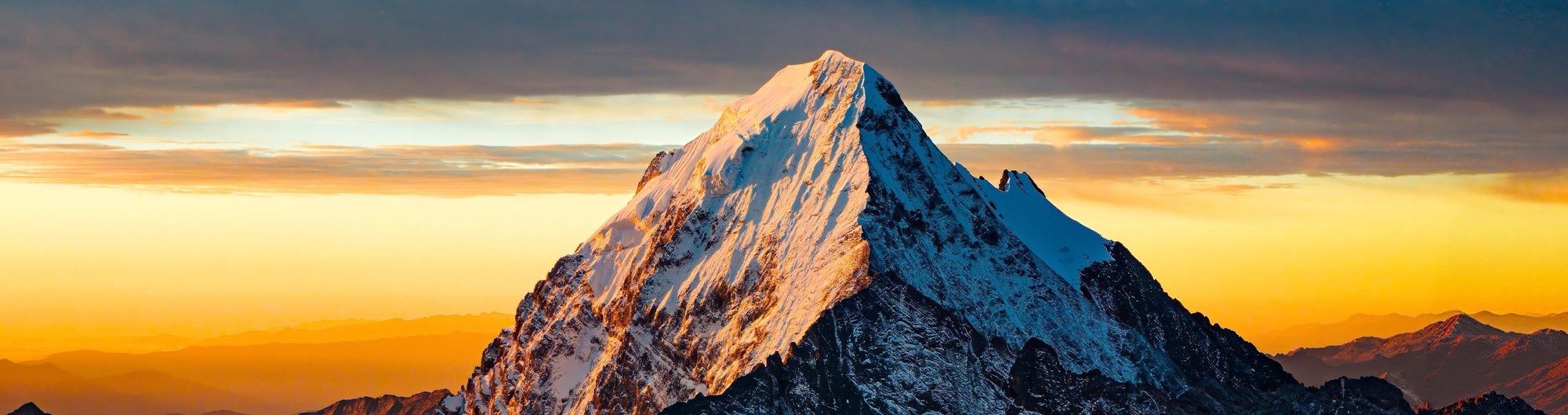 Dramatic close-up of a snow peak at sunset, Western Sichuan
