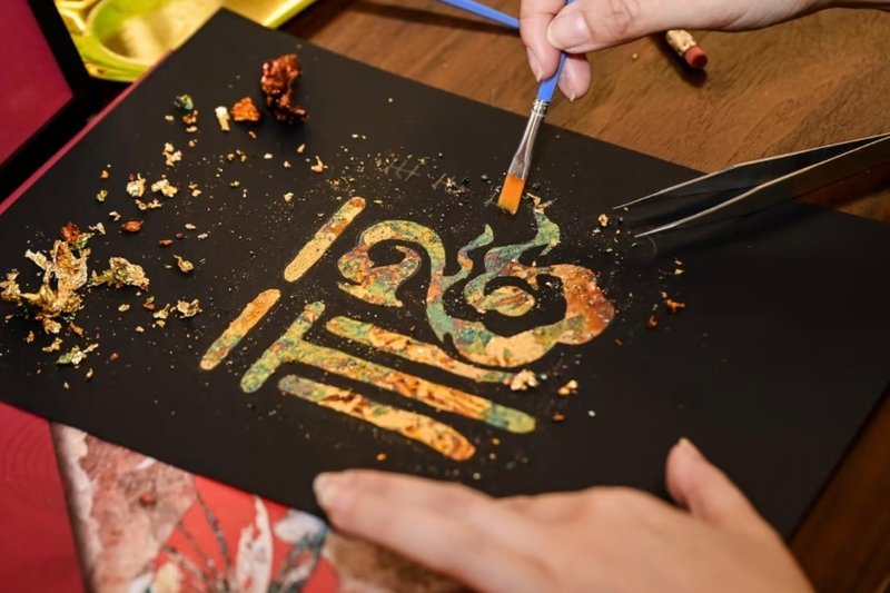 Gold leaf and mineral pigment craft artwork in progress, Chengdu