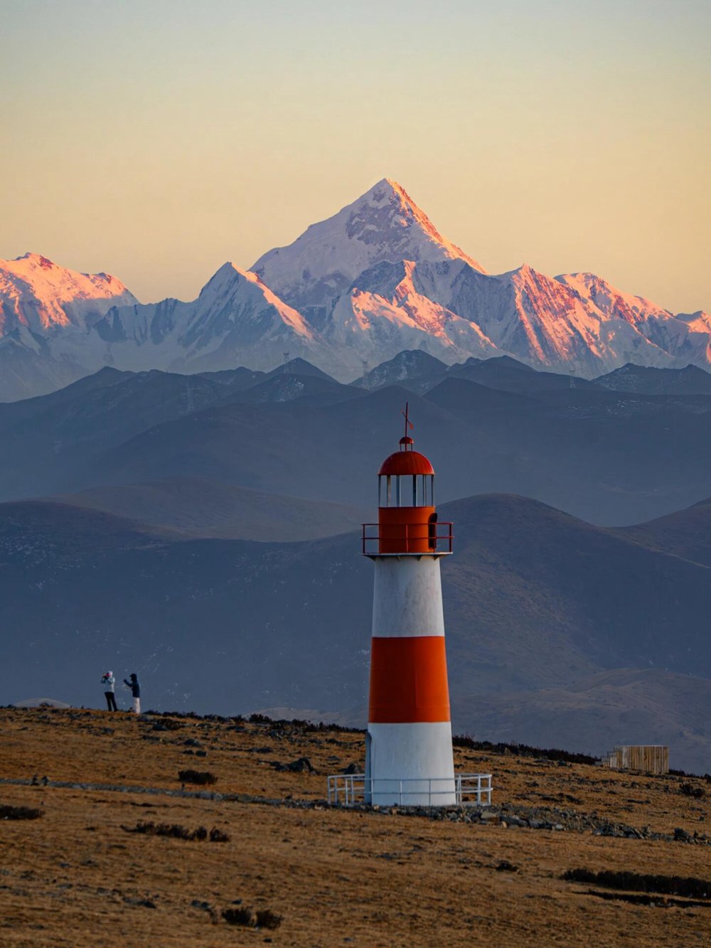 Lighthouse viewpoint with snow peak at sunset, Western Sichuan