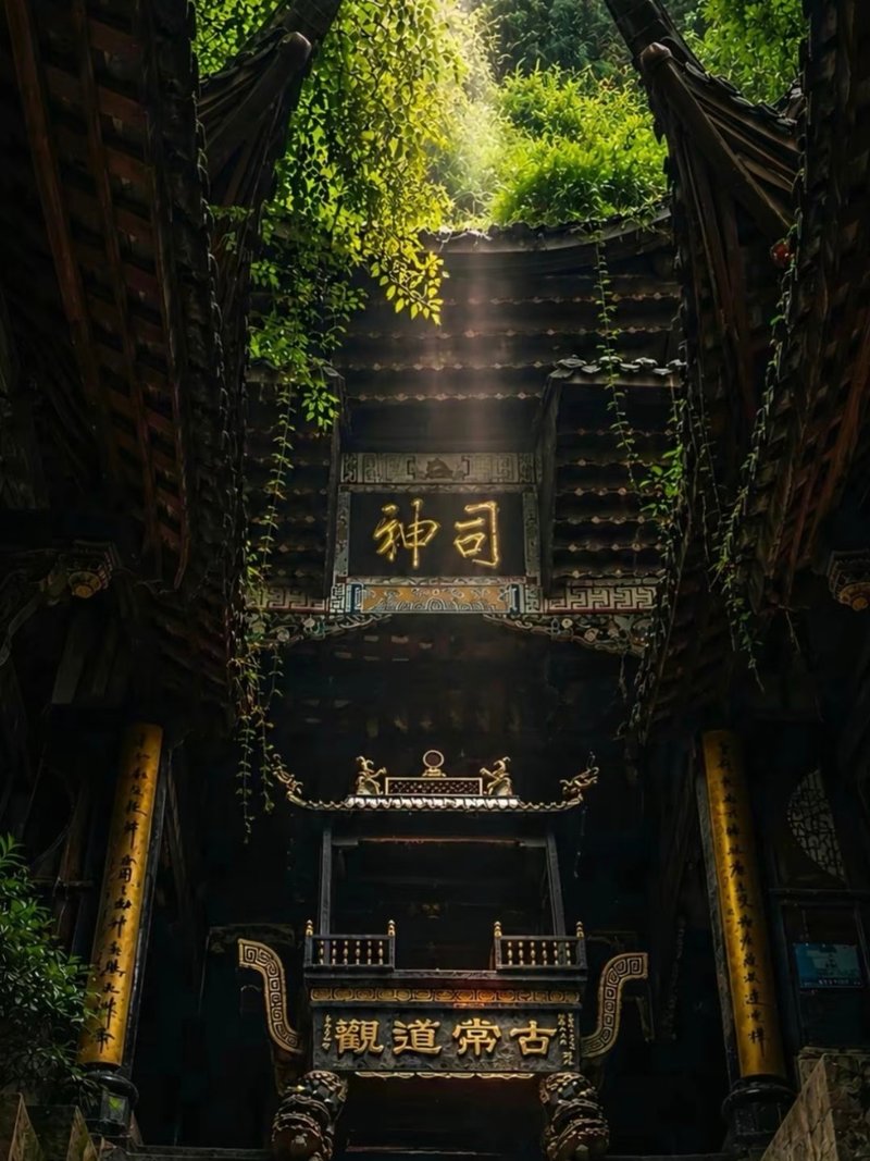 Ancient Taoist temple hall on Mount Qingcheng with a shaft of light