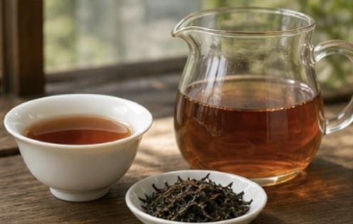 Black tea poured into a glass pitcher